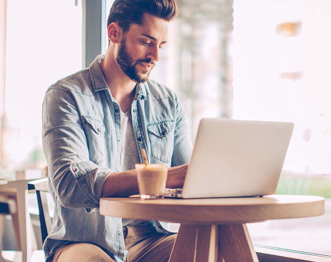 Man in retail store on laptop